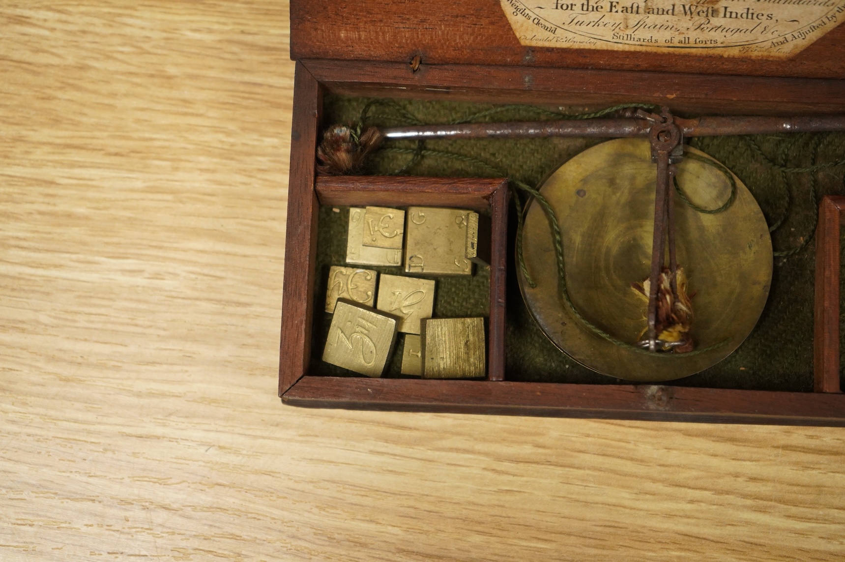 Four scientific instruments, consisting; a set of apothecaries steel balance scales, by Charles de Grave, 59, St. Martin’s le Grand…London; a set of three small drawing compasses, leather cased; a prismatic compass, by S